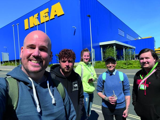 Smiling group of people outside of IKEA