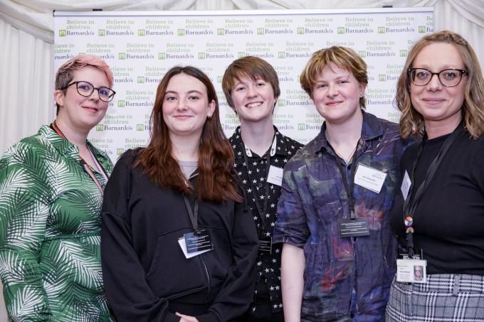 Three young people supported by Barnardo's standing beside Barnardo's voice and influence team staff and a Barnardo's practitioner at our summer parliamentary reception